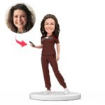 female doctor bobblehead india in red scrubs holding mobile with engraved name