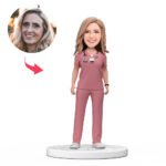 Custom female doctor bobblehead India in pink scrubs with engraved National Doctors Day text