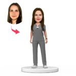 Custom female doctor bobblehead India in grey scrubs with engraved National Doctors Day text