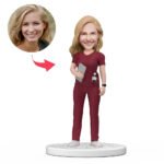 Custom female doctor bobblehead India in red scrubs holding tablet with engraved text